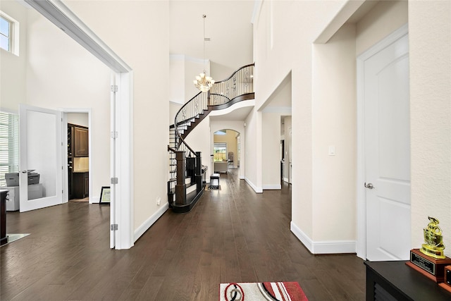 26407 Katy Springs Ln, Katy, TX 77494 - foyer with dark wood-style floors, baseboards, a high ceiling, and stairs
