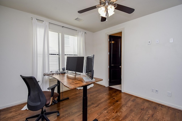 office featuring visible vents, ceiling fan, baseboards, and wood finished floors