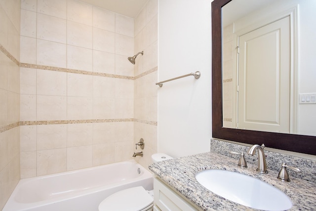 bathroom featuring bathing tub / shower combination, toilet, and vanity