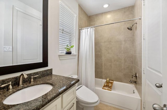 bathroom with toilet, shower / bath combo with shower curtain, vanity, and tile patterned floors