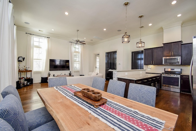 dining area with ceiling fan, ornamental molding, dark wood-type flooring, and recessed lighting