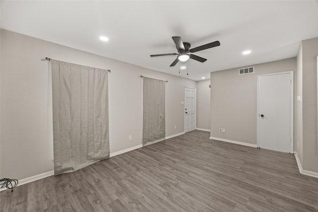 interior space featuring recessed lighting, visible vents, baseboards, and wood finished floors