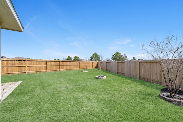 view of yard with a fenced backyard