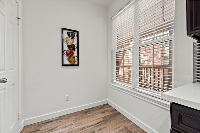 dining room with light wood-style floors and baseboards