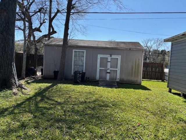 view of shed featuring a fenced backyard