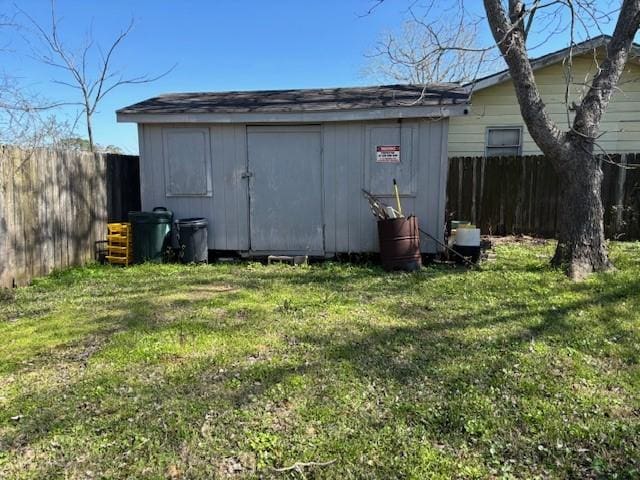 view of shed with fence