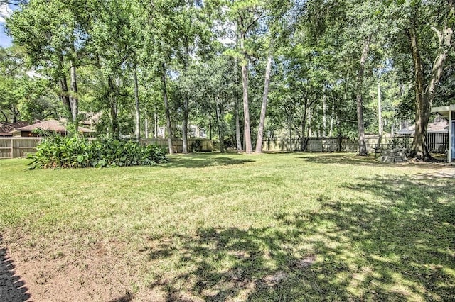 view of yard with a fenced backyard