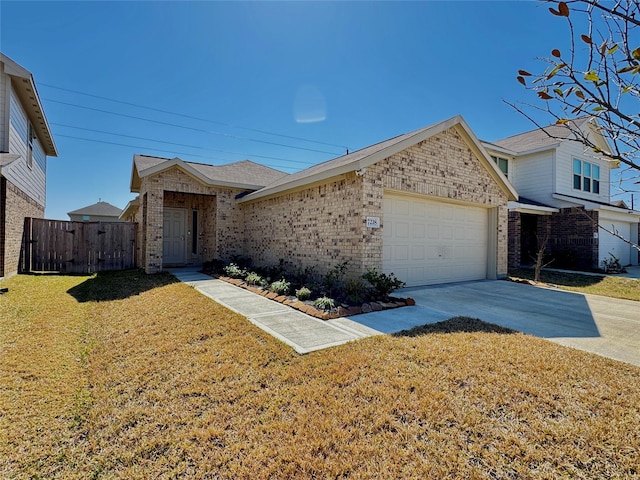 view of front of house with an attached garage, brick siding, fence, concrete driveway, and a front yard