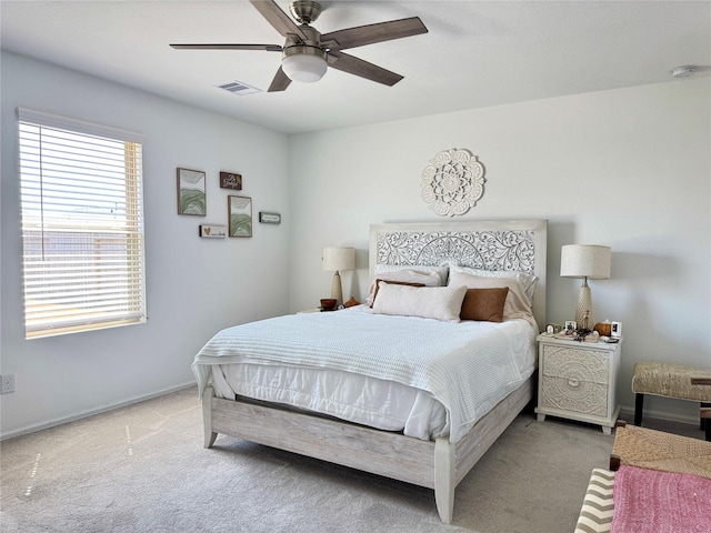 bedroom with a ceiling fan, carpet, visible vents, and baseboards