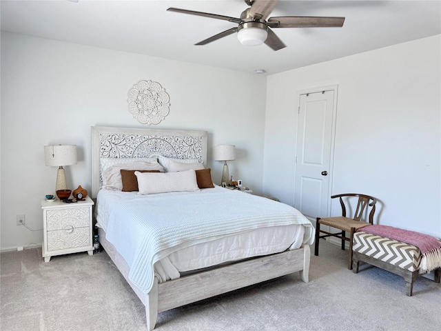 bedroom with a ceiling fan and carpet flooring