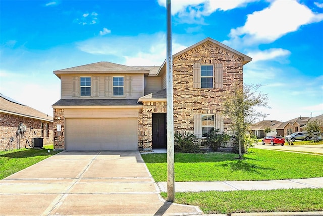 traditional home with central AC unit, driveway, an attached garage, a front lawn, and brick siding