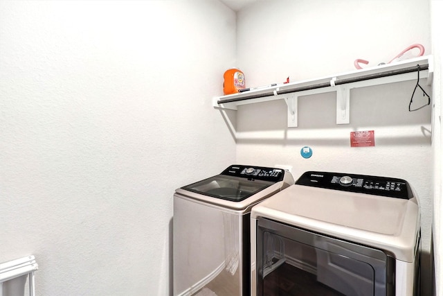 laundry area featuring laundry area and washing machine and dryer