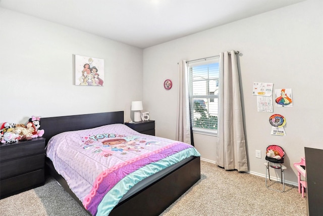 bedroom with baseboards and carpet floors