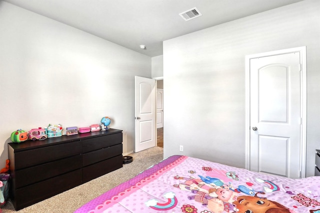 bedroom with visible vents and carpet