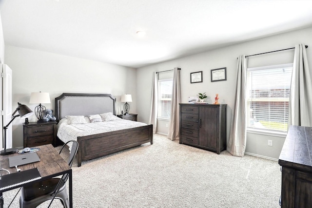 carpeted bedroom with baseboards