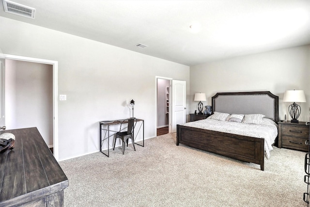 bedroom with visible vents, carpet floors, and baseboards