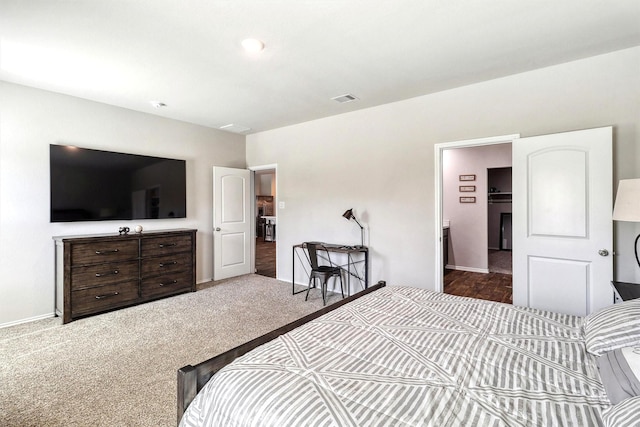 bedroom featuring visible vents, baseboards, and carpet floors