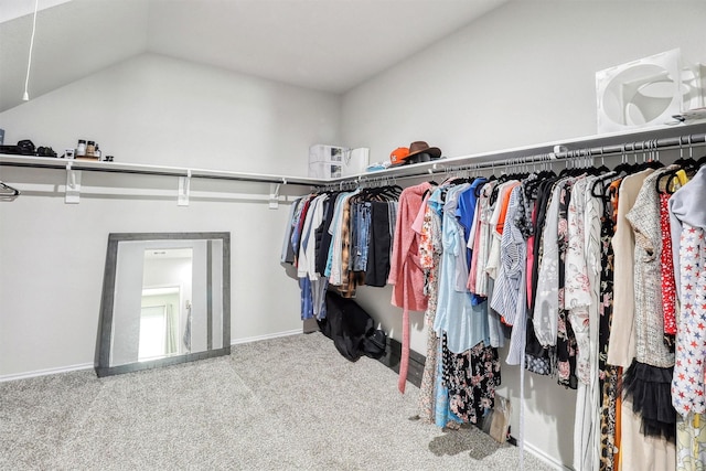 spacious closet featuring carpet floors and vaulted ceiling