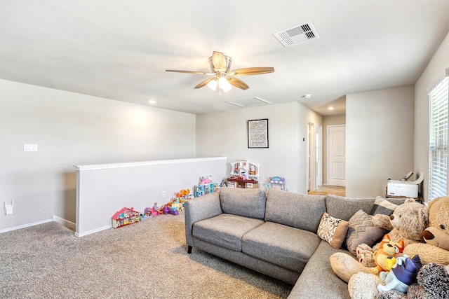 living room with visible vents, recessed lighting, carpet flooring, baseboards, and attic access