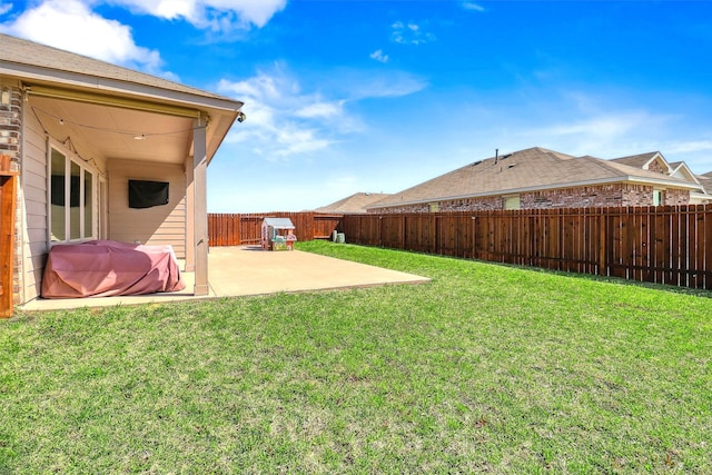 view of yard featuring a patio and a fenced backyard