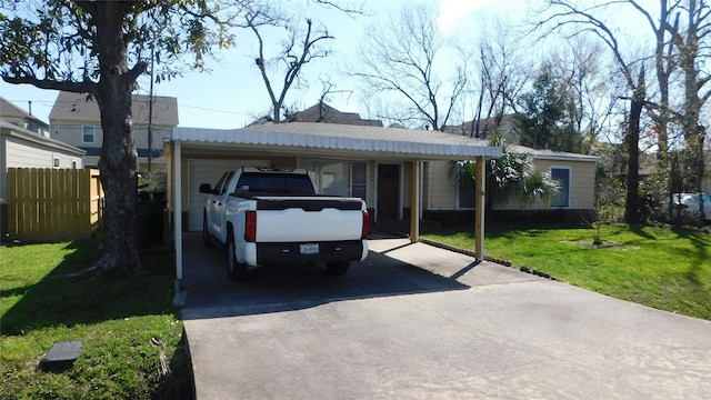 ranch-style house with aphalt driveway, fence, and a front lawn