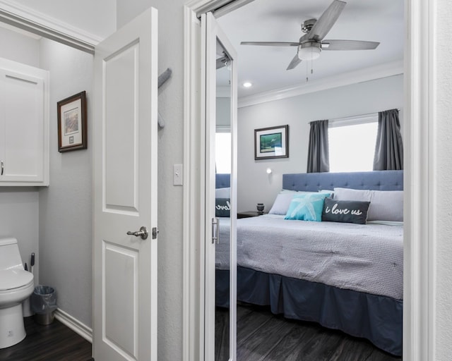 bedroom featuring baseboards, ceiling fan, dark wood-style flooring, and crown molding