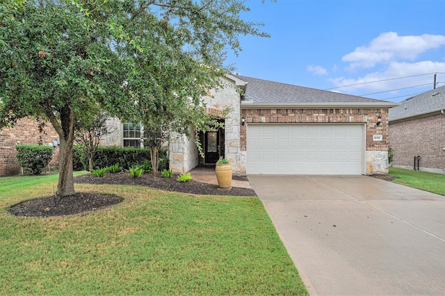 view of front of home with an attached garage, driveway, a shingled roof, and a front yard