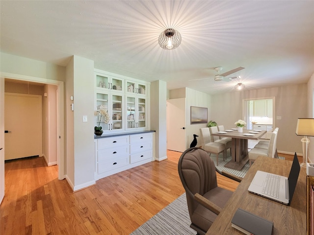 office featuring light wood-style floors, visible vents, and baseboards