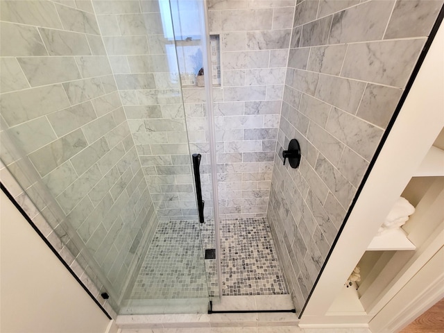 full bath with a shower stall