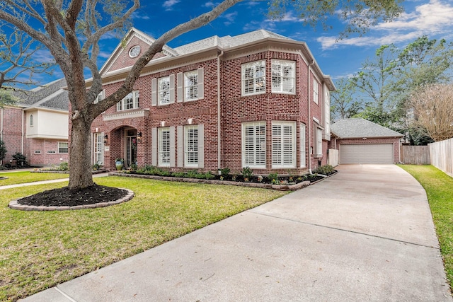 view of front facade featuring a garage, a front yard, fence, and brick siding