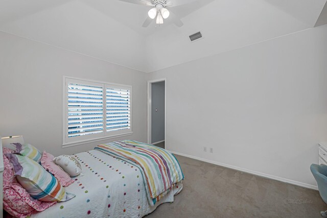 carpeted bedroom featuring lofted ceiling, baseboards, visible vents, and a ceiling fan