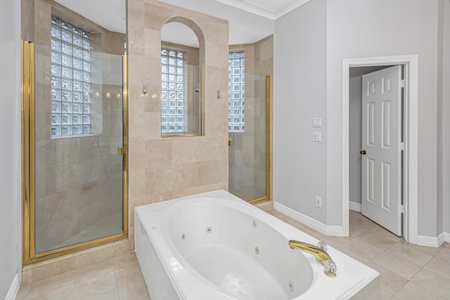 bathroom featuring a whirlpool tub, a shower stall, and tile patterned flooring