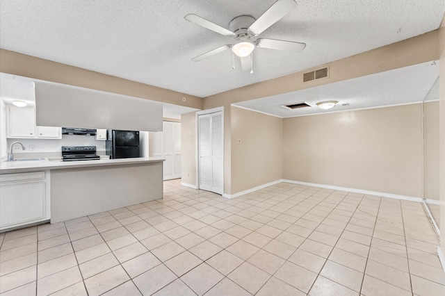 kitchen with visible vents, extractor fan, light countertops, black appliances, and a sink