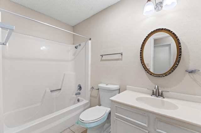 bathroom with a textured ceiling, tile patterned flooring, toilet, vanity, and shower / bathing tub combination