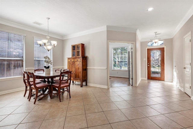 dining area featuring visible vents, baseboards, ornamental molding, a chandelier, and light tile patterned flooring