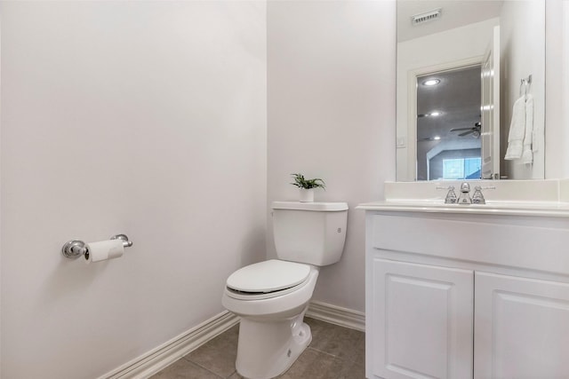 bathroom with visible vents, baseboards, toilet, tile patterned flooring, and vanity