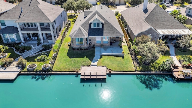 aerial view featuring a water view and a residential view