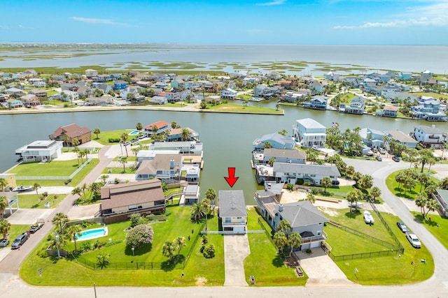 bird's eye view featuring a residential view and a water view