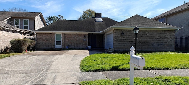 view of front facade featuring a garage, brick siding, fence, a front lawn, and a chimney