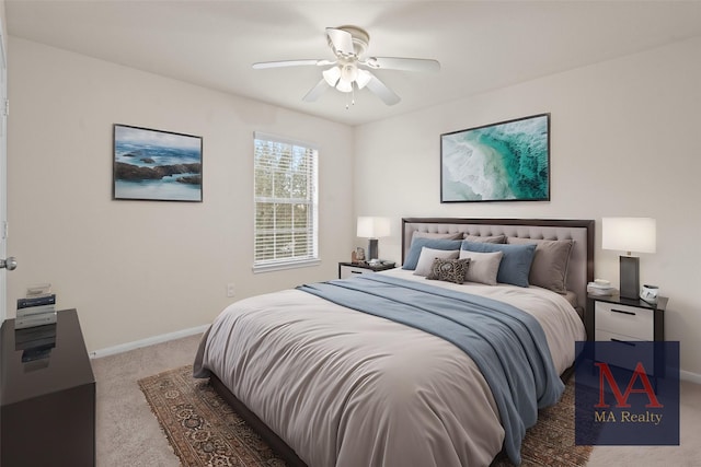 carpeted bedroom with a ceiling fan and baseboards