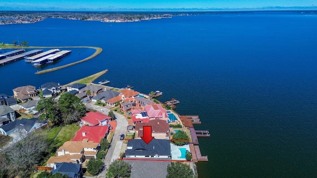 bird's eye view featuring a residential view and a water view