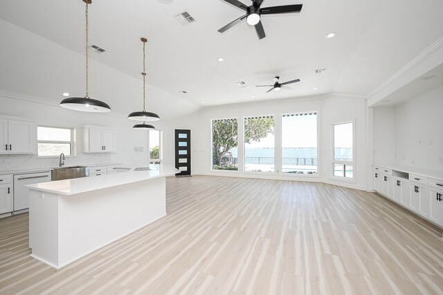 kitchen featuring open floor plan, light countertops, white dishwasher, and visible vents