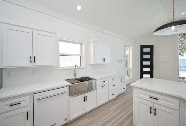 kitchen featuring ornamental molding, white cabinets, white dishwasher, a sink, and light wood-type flooring