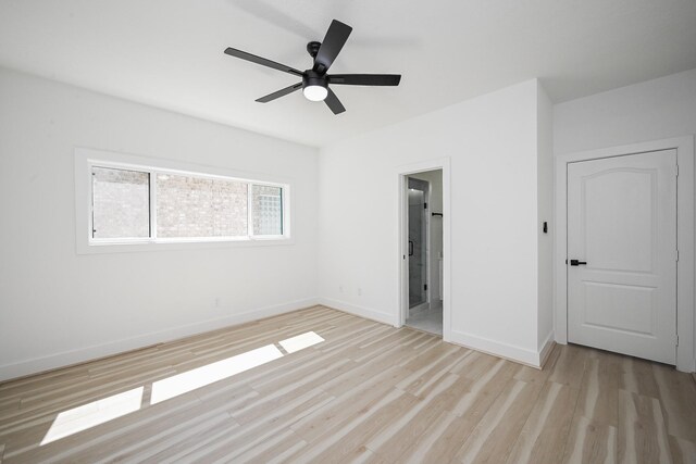 unfurnished bedroom featuring a ceiling fan, baseboards, and wood finished floors