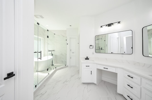 full bath with marble finish floor, a freestanding bath, vanity, and a marble finish shower