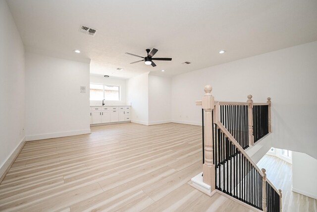 spare room featuring recessed lighting, visible vents, light wood-style flooring, and baseboards