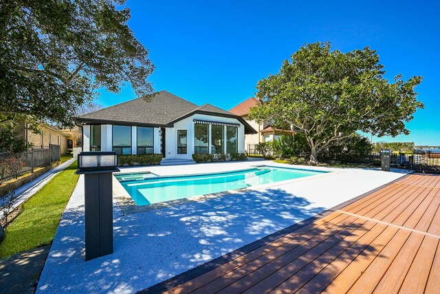 view of pool featuring a deck, an in ground hot tub, fence, and a fenced in pool