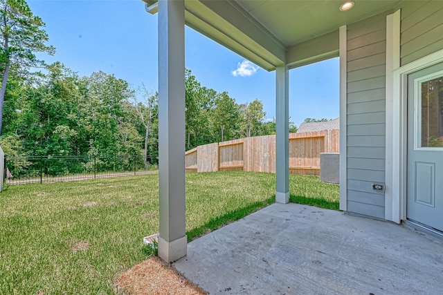 view of yard featuring a patio area and fence