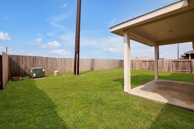 view of yard with a patio and a fenced backyard