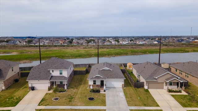 aerial view featuring a residential view and a water view